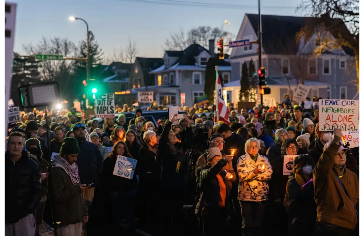 Family and neighbors hold a candlelight vigil in Minneapolis after a woman was shot by an ICE agent near her home