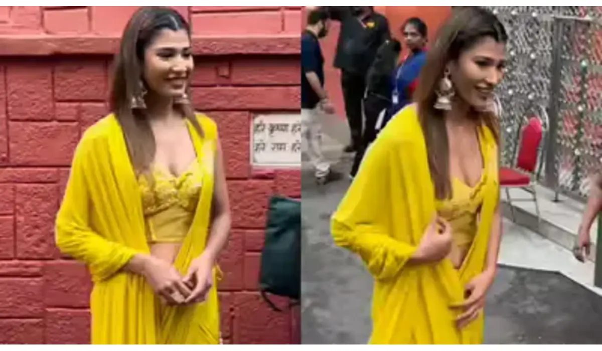 Bigg Boss 19’s Nehal Chudasama smiles for paparazzi outside ISKCON Juhu after eviction in a yellow ethnic outfit.