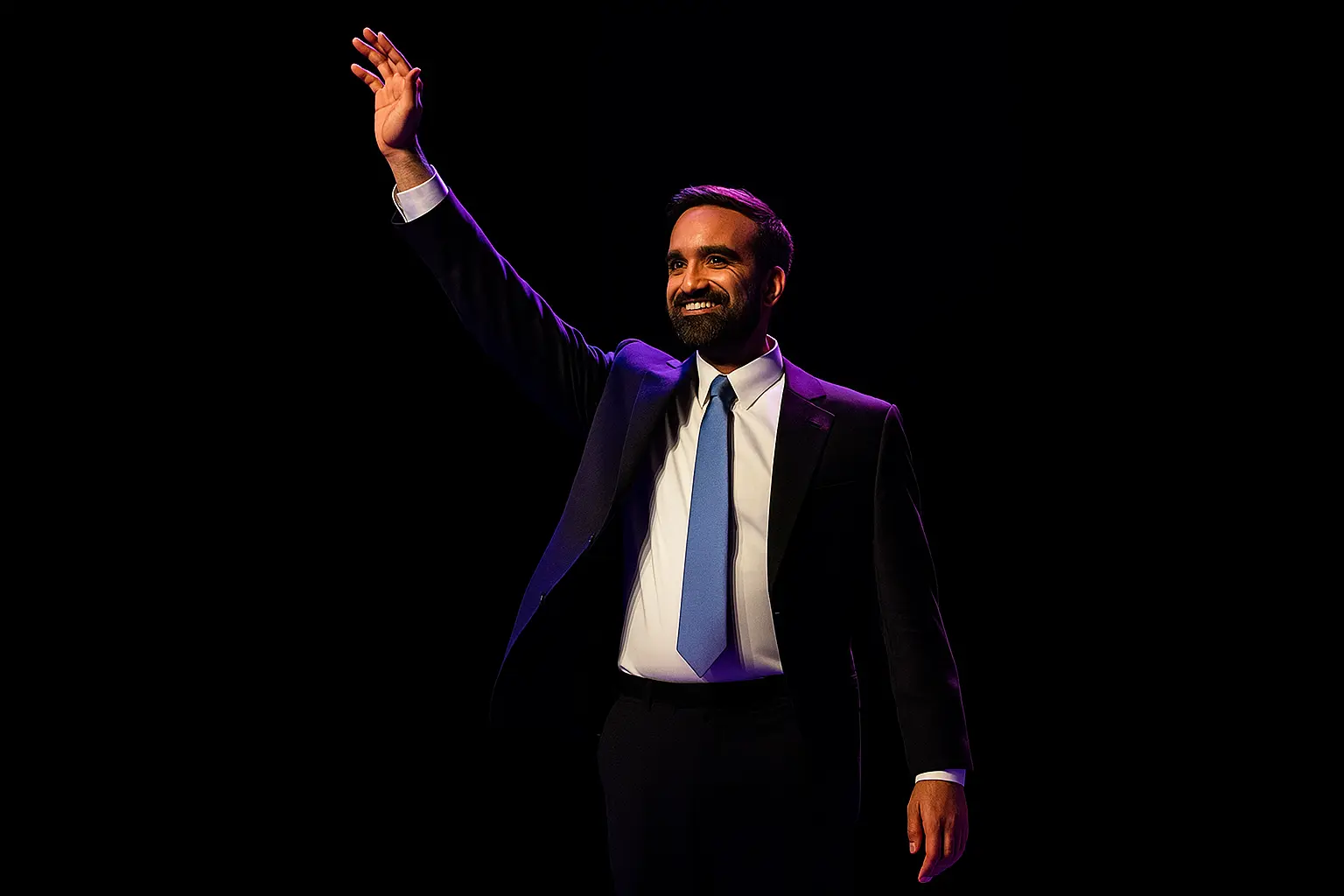 Zohran Mamdani waves to supporters on stage after his 2025 New York City mayoral election victory.