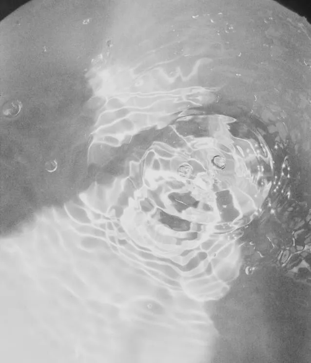 pot of water about to simmer, energetic ripples start to bubble