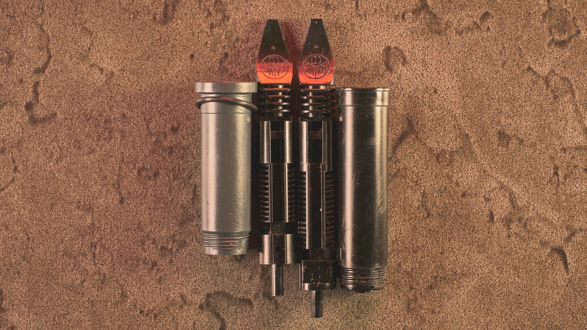 Photo of the housing & feed of the 190 unit next to the feed & housing of the 060 unit