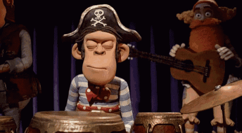 Claymation monkey rolling its eyes and playing "ba-dum-tish" on the drums