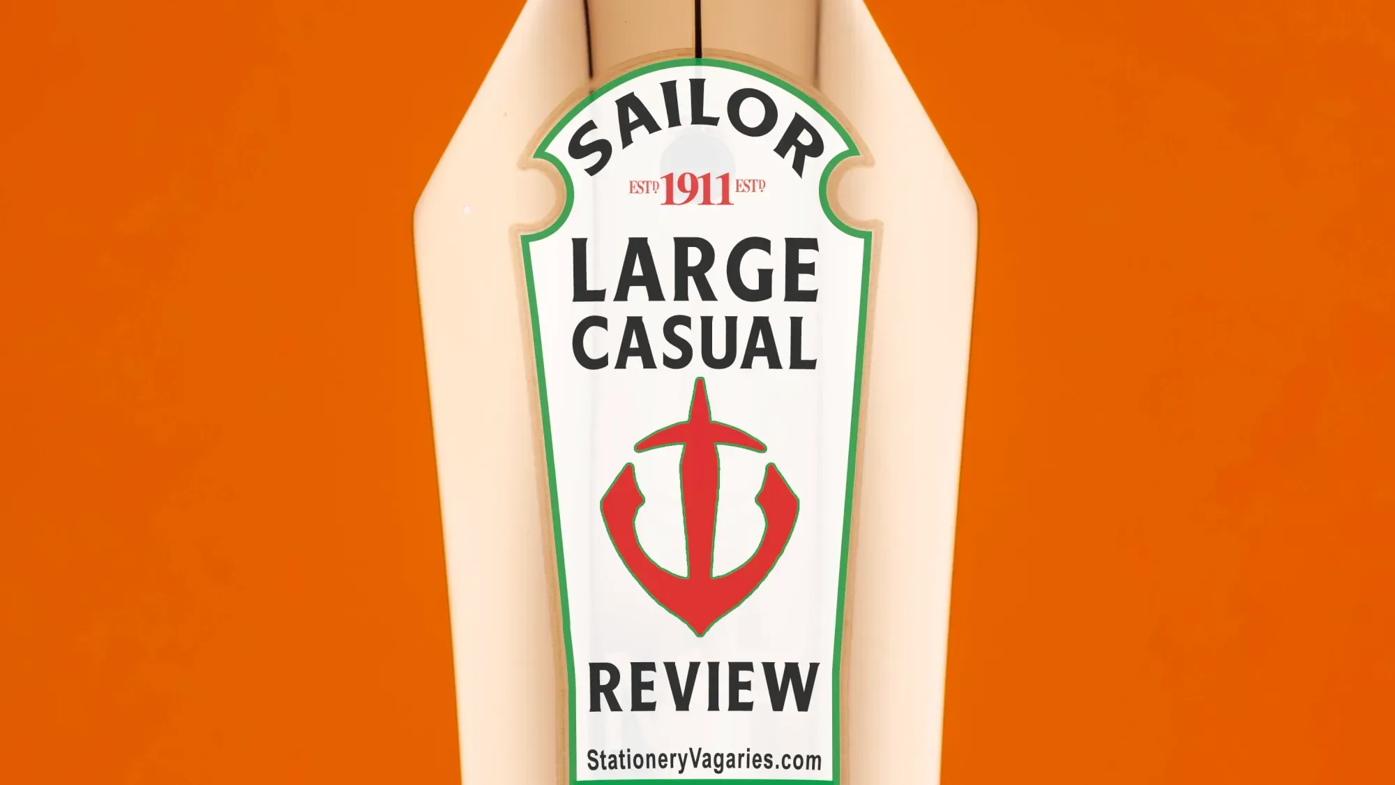 Close-up photo of the Sailor 1911 Large Casual on an orange background. The gold-plated nib has a mock Heinz Ketchup bottle logo with the nibs detailed in place of the usual Heinz wording.