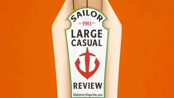 Close-up photo of the Sailor 1911 Large Casual on an orange background. The gold-plated nib has a mock Heinz Ketchup bottle logo with the nibs detailed in place of the usual Heinz wording.