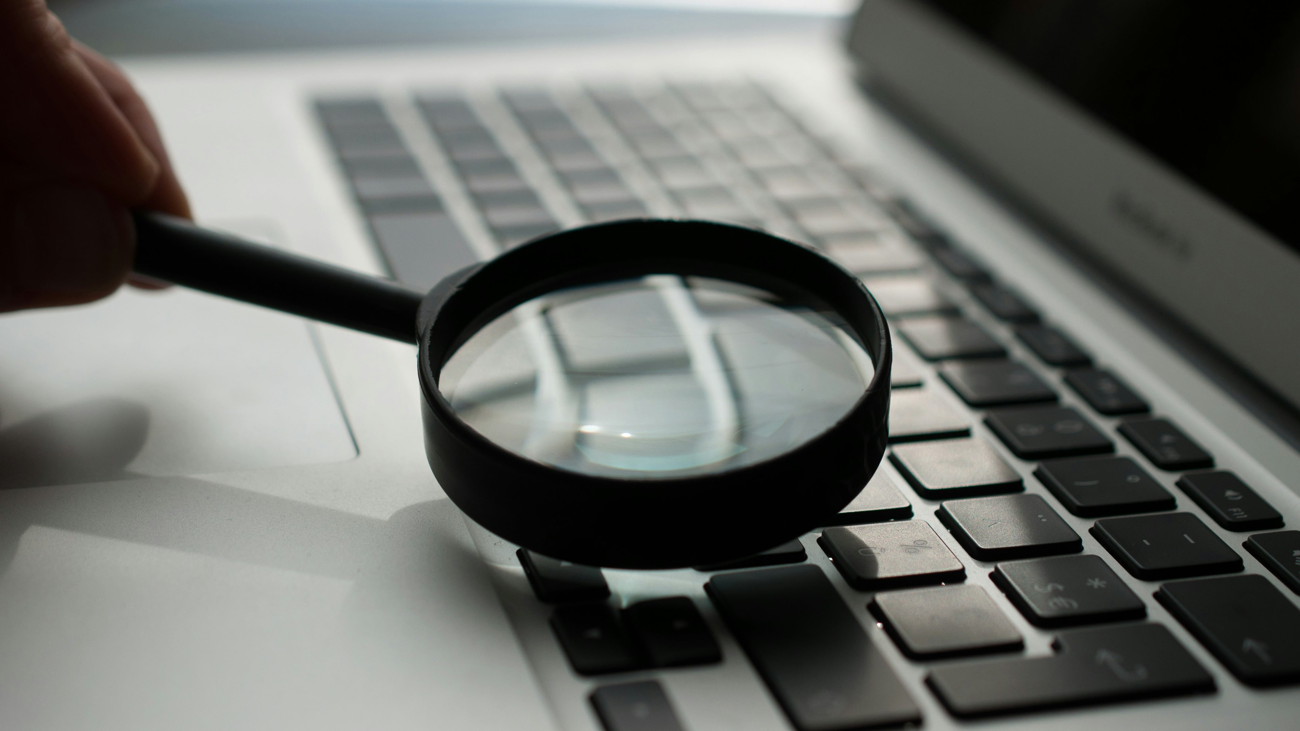 magnifying glass laptop photo