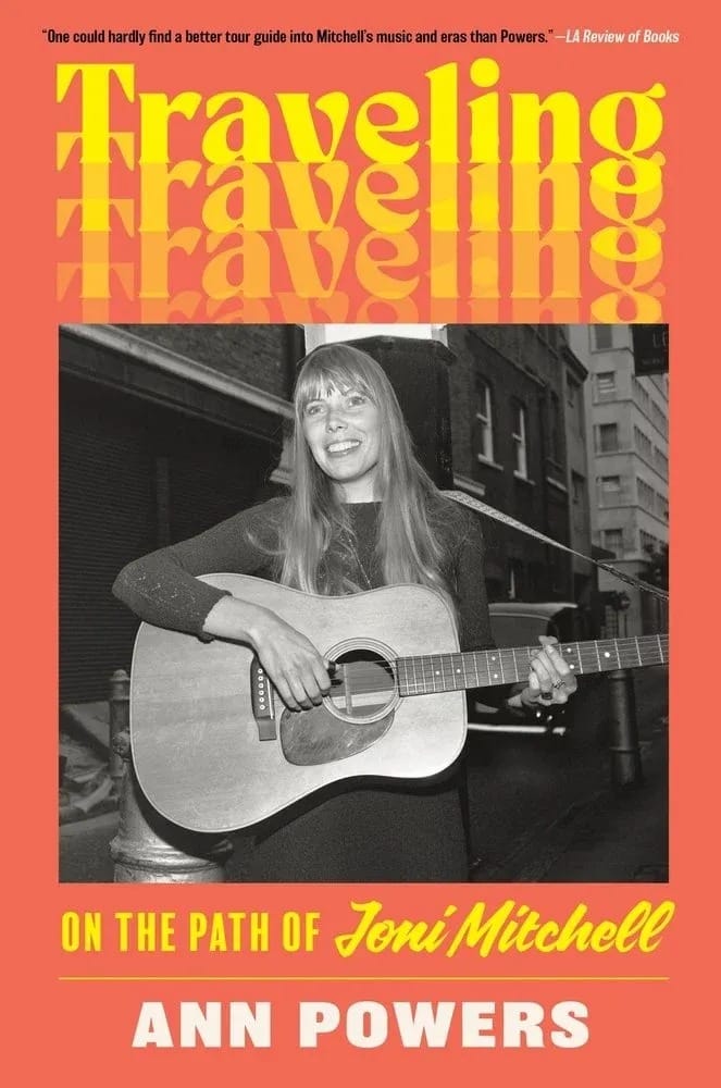 A book cover showing young Joni Mitchell with a guitar