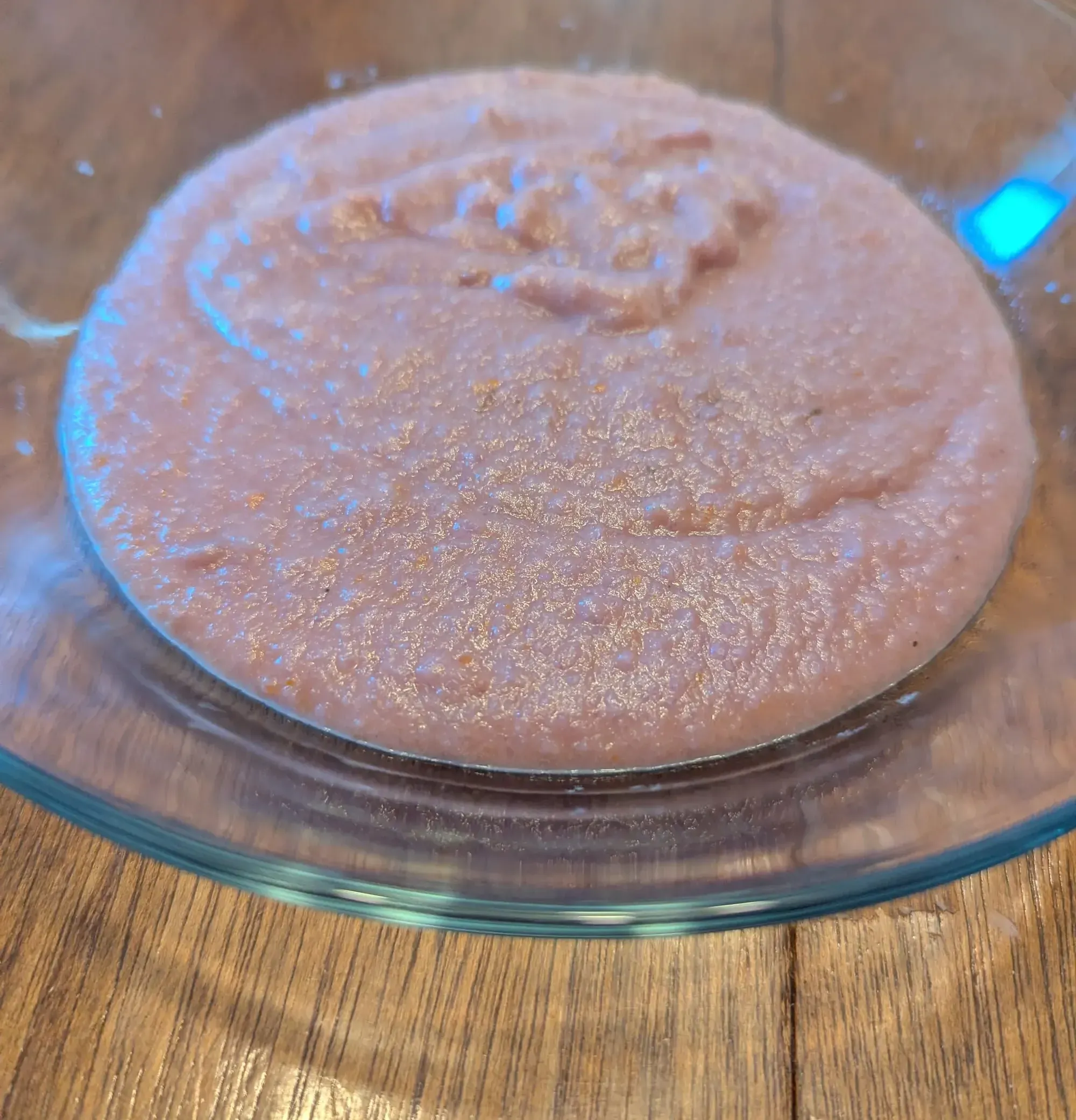 Close-up photo of purple cauliflower soup in a glass bowl