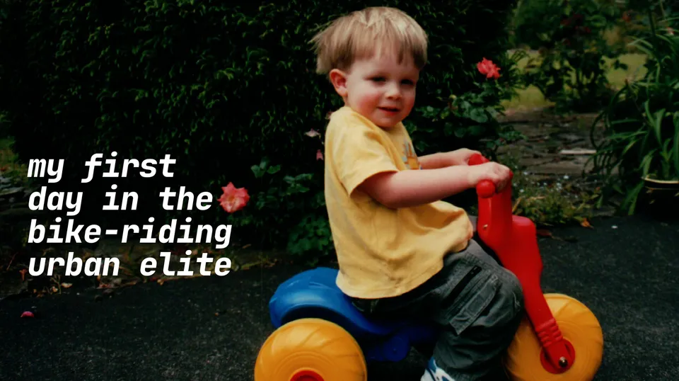 A picture of baby me riding my tricycle.