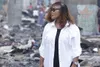 La ministre Myss Belmonde Dogo dans le village Abia-Gnambo à Petit-Bassam, suite à l'incendie tragique dans la nuit du 2 au 3